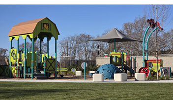 A playground with a large green and yellow structure, a blue slide, and a red swing.

AI generated content