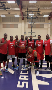 A group of men wearing red shirts and black shorts pose for a picture on a basketball court.

AI generated content