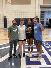 Four people pose for a photo on a tennis court.

AI generated content