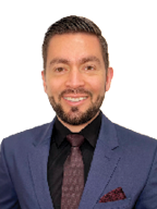 A man wearing a blue suit and tie.

Description generated by AI