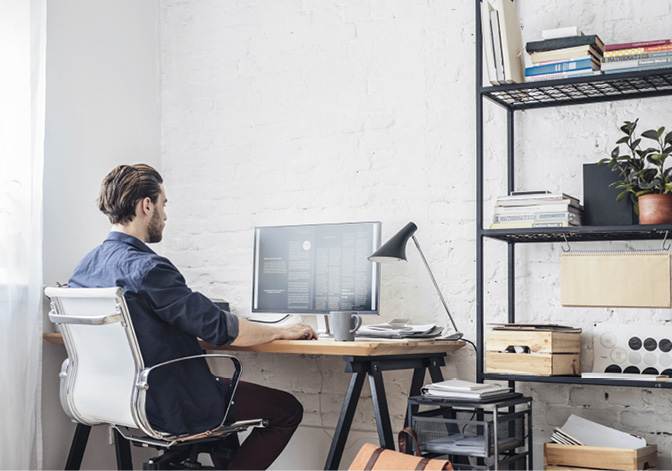 Young man working on his computer.