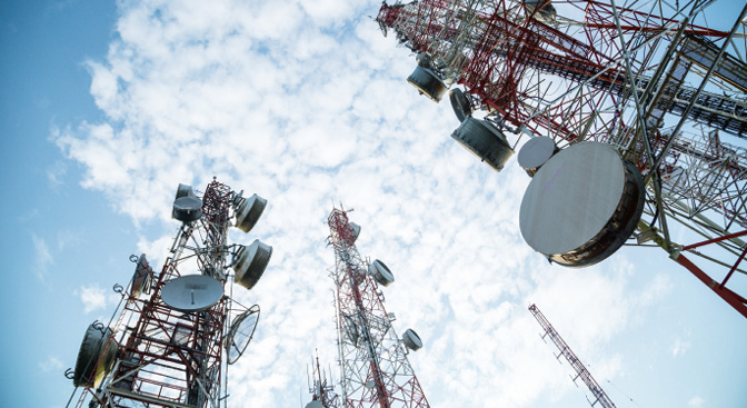 Telecommunication mast TV antennas wireless system technology with blue sky in the morning.