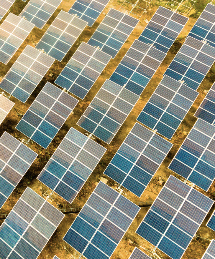 Beautiful sunset over Solar Farm with sunset on the background.