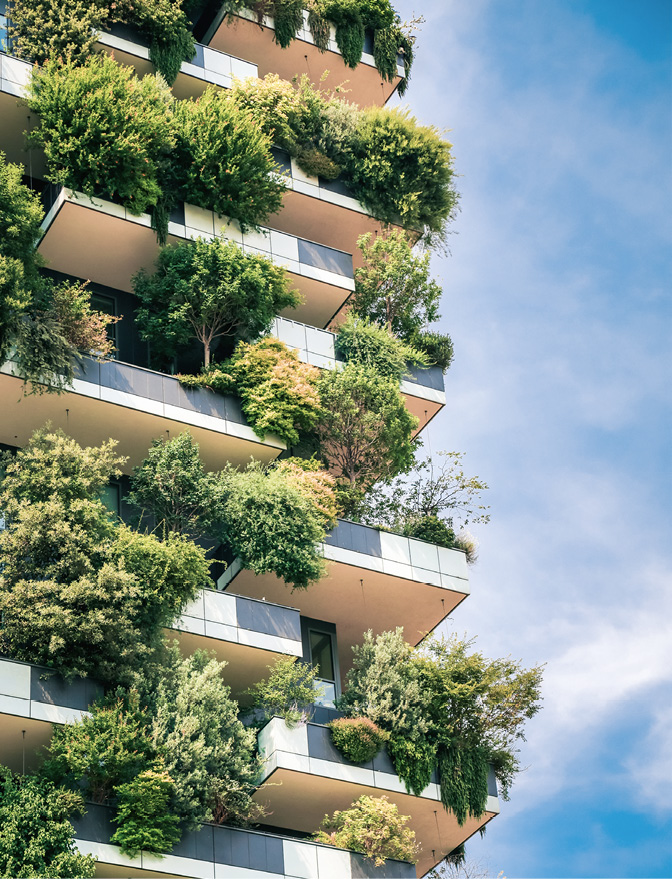 Milan, Italy - June 15, 2019: Green futuristic skyscraper Bosco Verticale, vertical forest building with gardens on balconies. Modern sustainable architecture in Porta Nuova area.