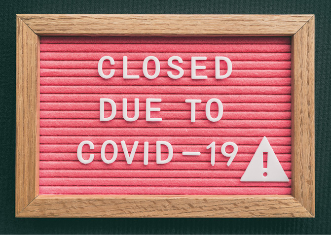Coronavirus store closure sign. Closed due to COVID-19 message board for retail business COVID-19 pandemic outbreak. Government shutdown of restaurants, bakeries, non essential services. Pink letters.
