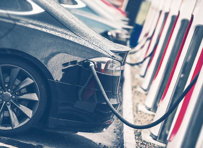Electric Cars Charging Station Closeup Photo. Vehicle Rechargeable Batteries Charing. Future of Transportation.