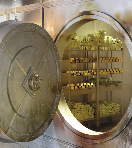 An open safe with gold and banknotes.