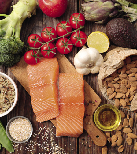 Different types of food on wooden table.