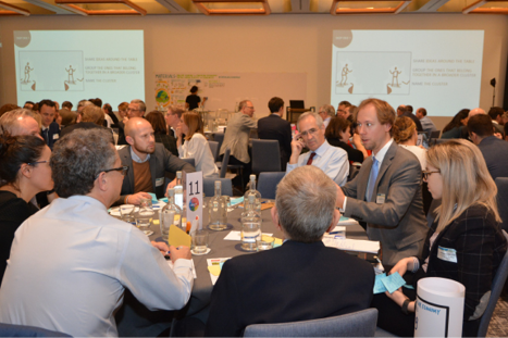 Photo from event Trustworthy AI with speaker, audience and robot.